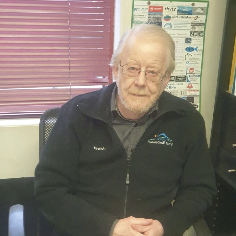 Guðbrandur Jóhannsson at his desk in a Vatnajökull Travel fleece